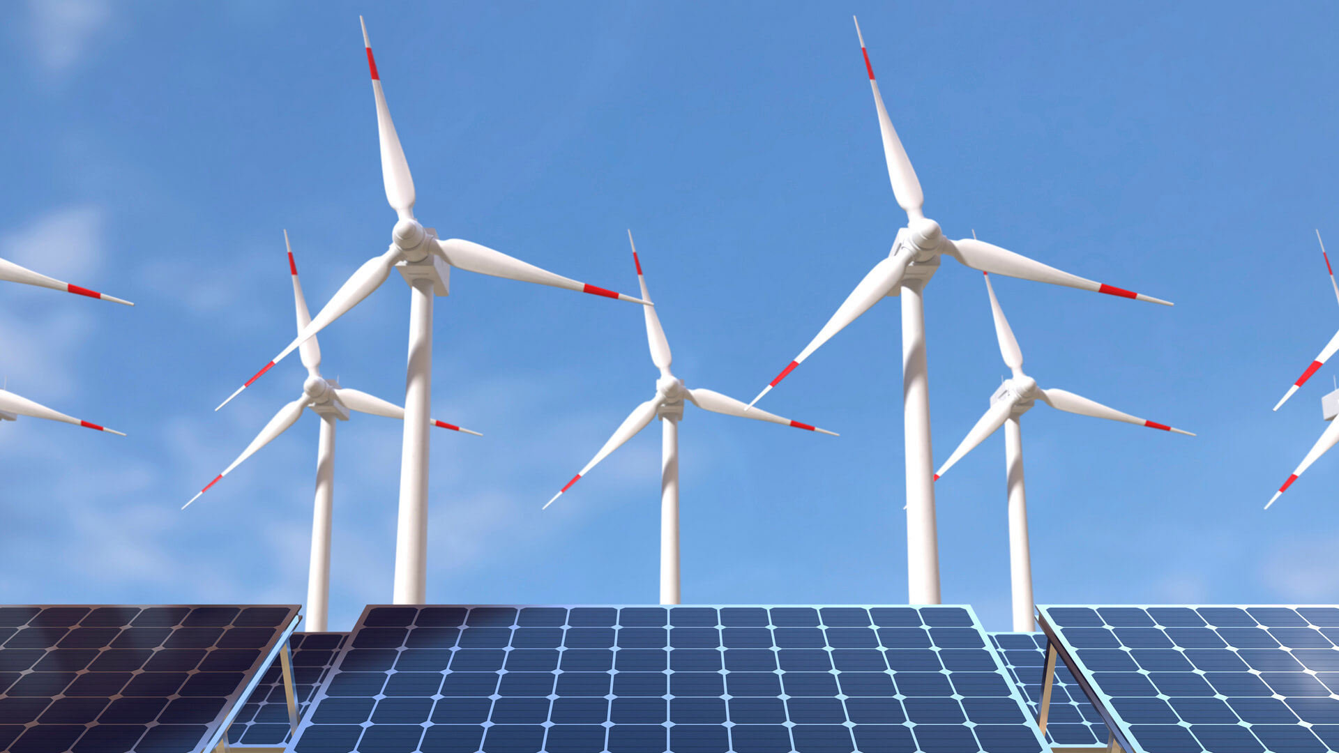 Wind turbines and solar panels under a clear blue sky generate renewable energy, powering a nearby data center.