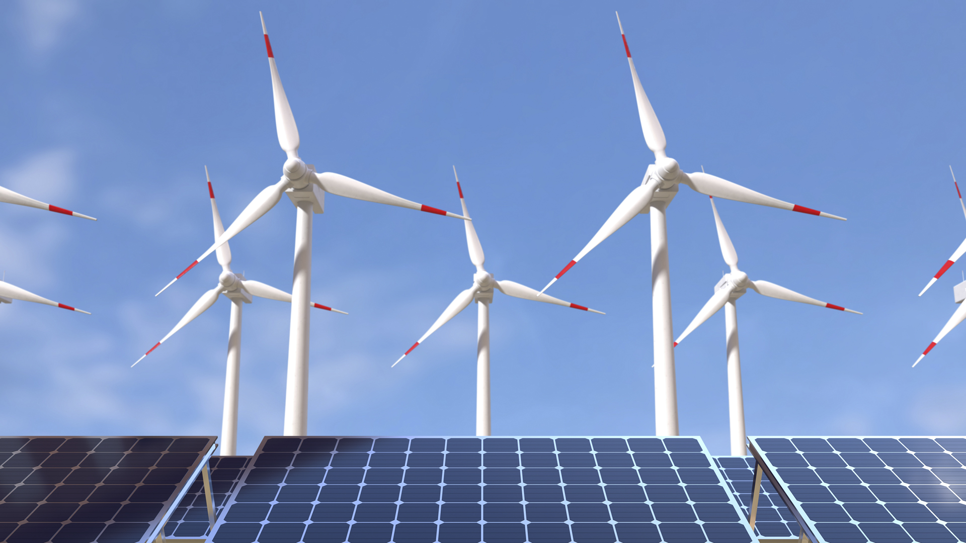 Wind turbines and solar panels under a blue sky.