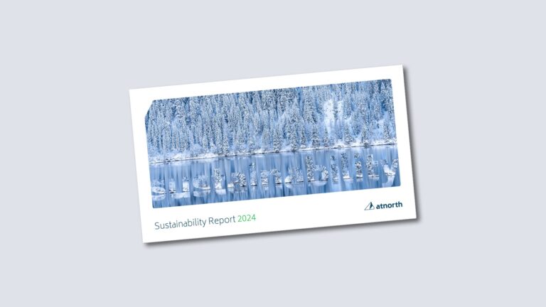 Cover of a sustainability report titled "Sustainability Report 2024" featuring a snowy forest and lake scene, with the logo "atnorth" in the corner.