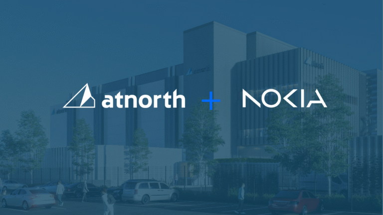 Logos of atnorth and Nokia with a plus sign between them, overlaid on an image of a modern data center building with parked cars and people outside.
