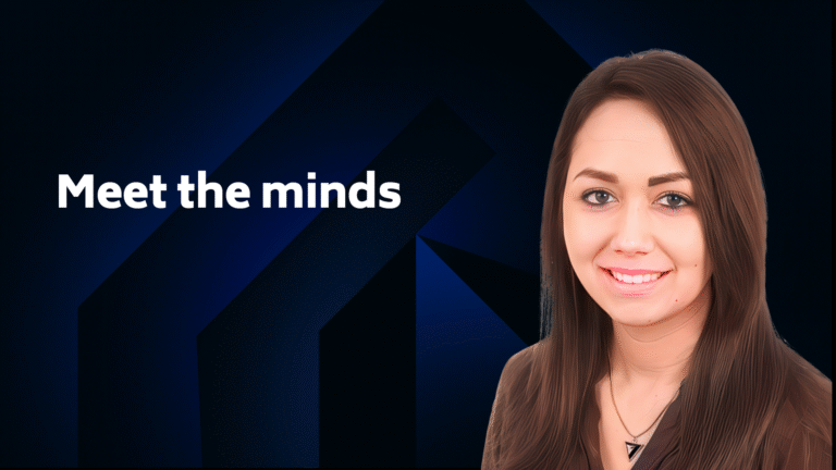 A woman with long brown hair smiles at the camera next to the text "Meet the minds" on a dark blue geometric background.