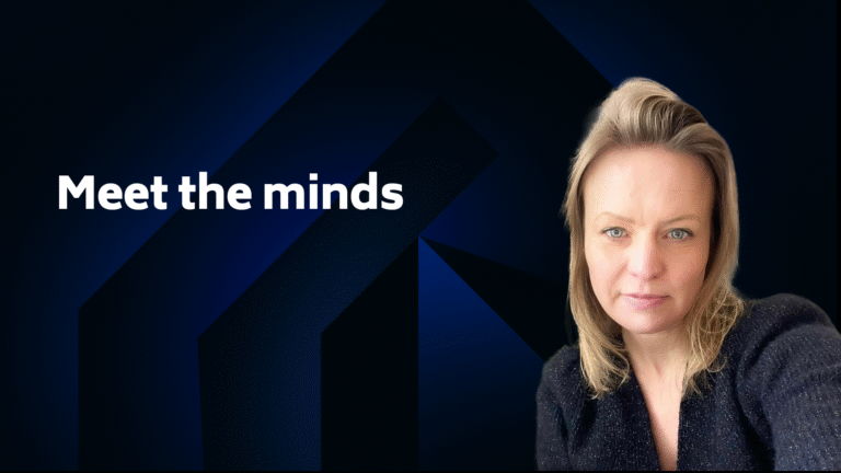 A woman with blonde hair sits in front of a dark geometric background with the text "Meet the minds" displayed on the left.