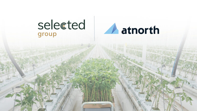 Logos of Selected Group and atnorth above a large greenhouse filled with rows of young plants on raised beds.