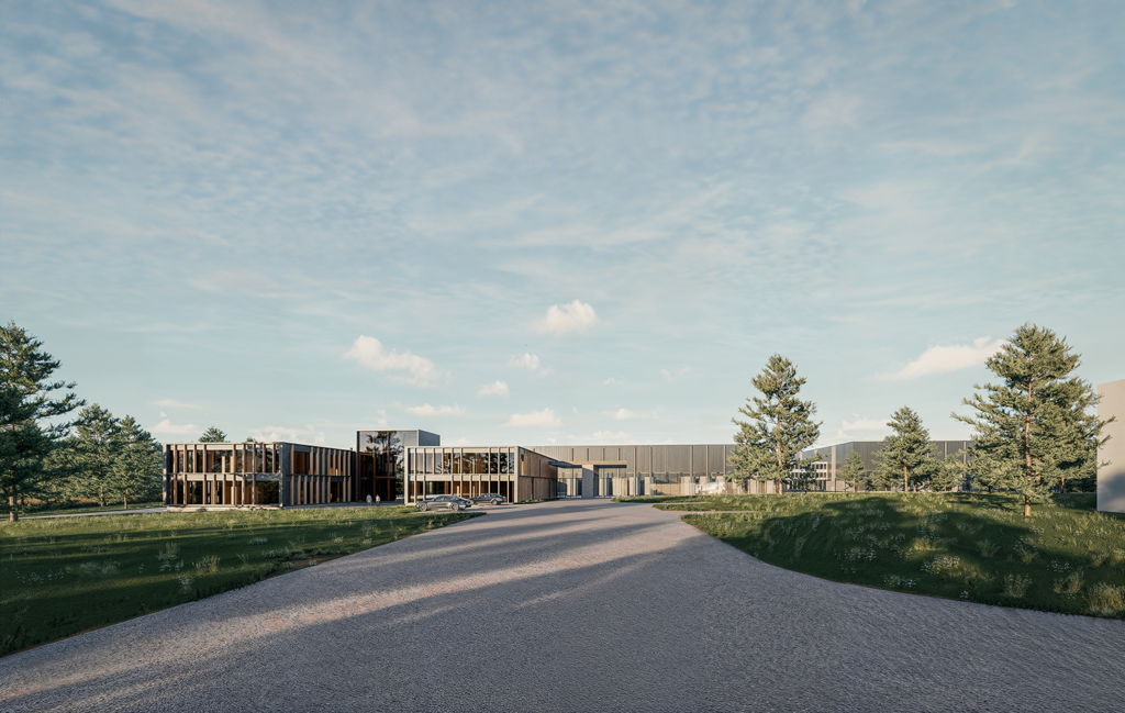 Modern multi-building commercial office and warehouse complex with a paved driveway and surrounding trees.